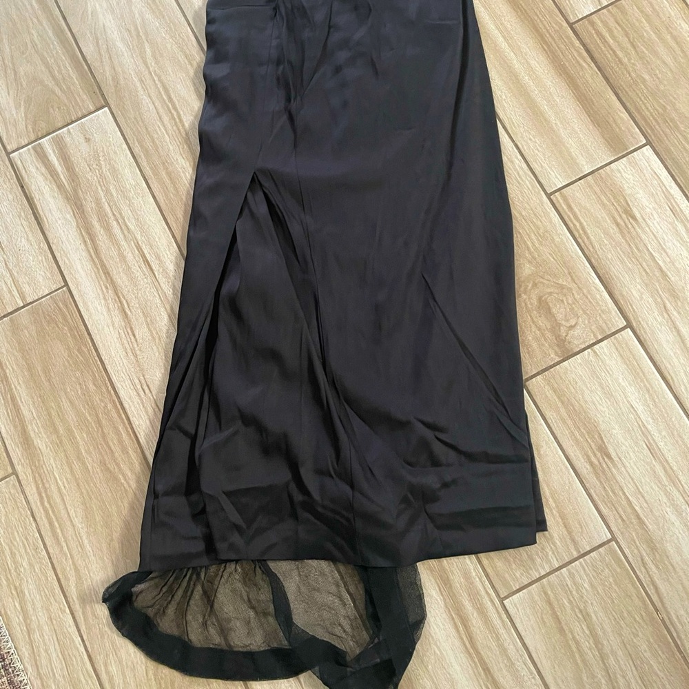 Dolce and Gabbana black silk skirt and elastane.